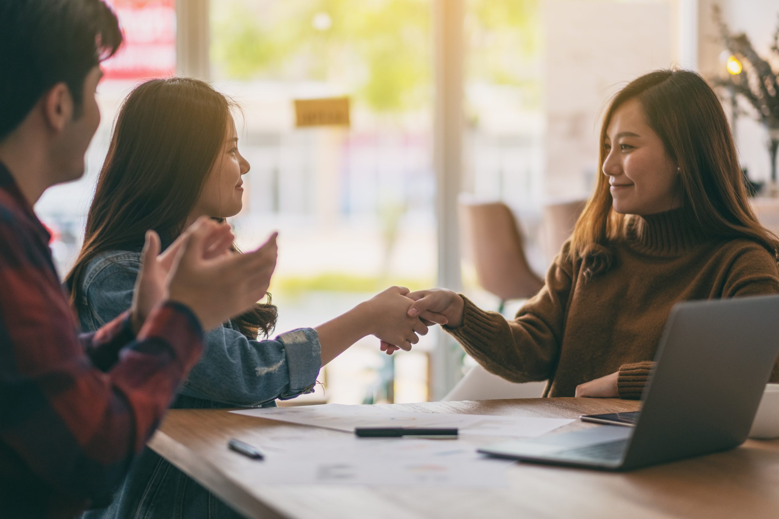 Asian businessman working and shaking hands in a meeting
